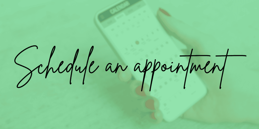 Female hand holds a smart phone displaying a calendar. "Schedule an appointment. 