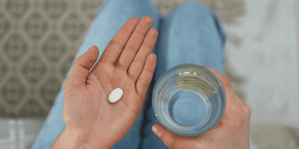 woman holding the abortion pill
